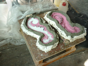 Polyurethane casting hardening in its silicone and plaster mould.