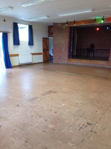 Photograph of the interior of the village hall looking onto the stage